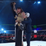 Dominik Mysterio Captures AAA Mega Title At WWE x AAA Worlds Collide, Forces Rey Mysterio To Put Title Around His Waist
