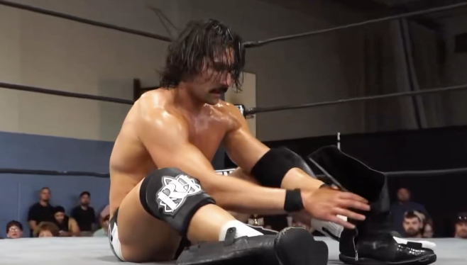 Richard Holliday Leaves His Boots In The Ring At GCW Melee In Manchester